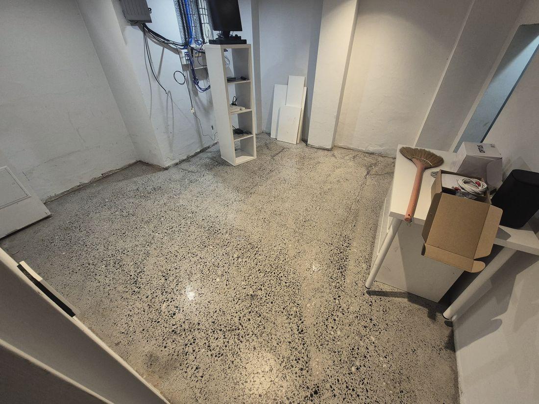 The same floor finished, with pale aggregate showing right across