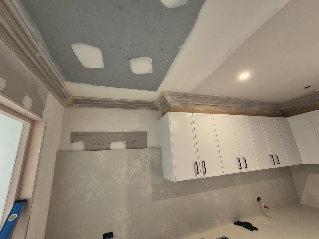 A patched plasterboard ceiling and cornice on a live job in south west Sydney